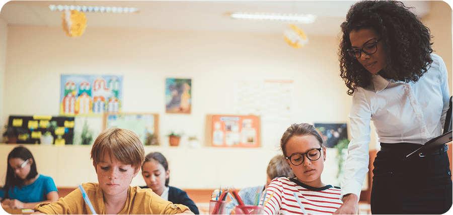 Educator helping young students